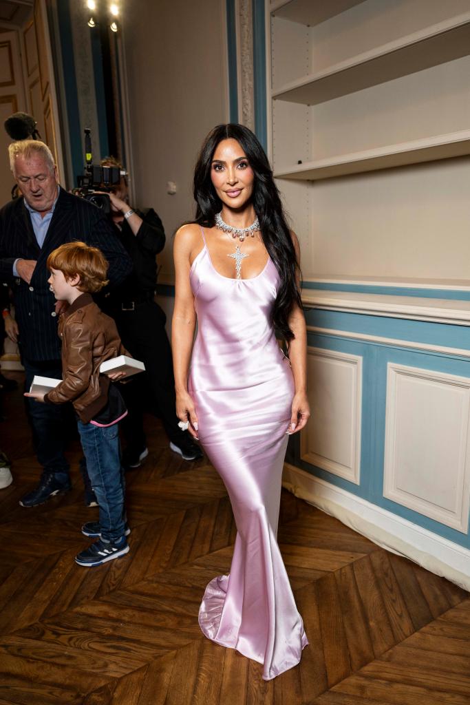 Kim Kardashian in long silk pink dress.