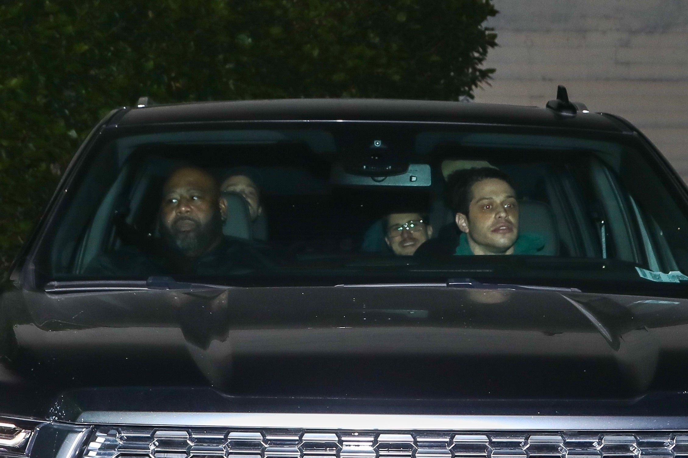 Pete Davidson driving people in his car